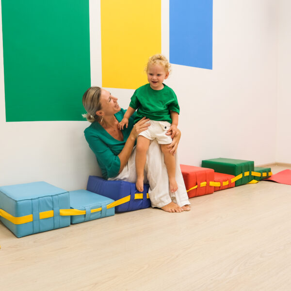child and mom in kindergarten gym
